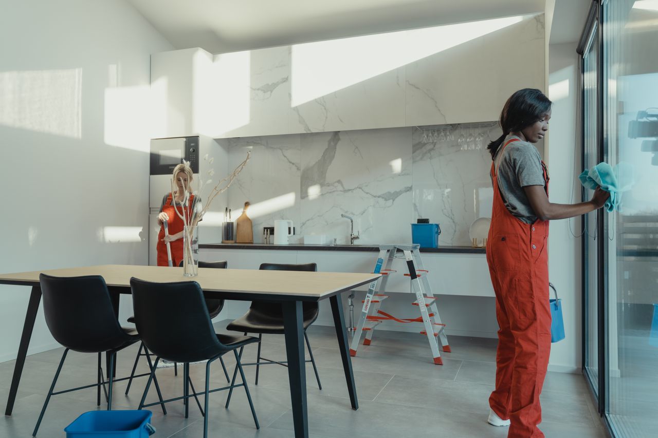 Scent and Fresh team cleaning a bright modern kitchen